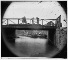Date Created/Published: 1865.
Summary: Photograph of the main eastern theater of war, fallen Richmond, April-June 1865. This photograph shows Canal Bridge at foot of 7th Street, Richmond. Shows African American children standing on the bridge.